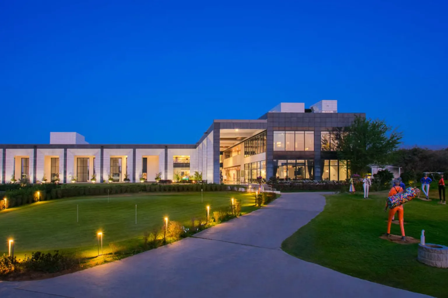 Karma Lakelands eco resort lawns and water body near Manesar